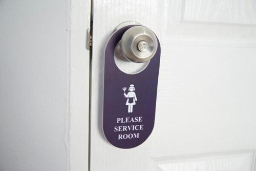 a tag on a door with a woman on it at Blue26 in Ban Wat Sala Daeng