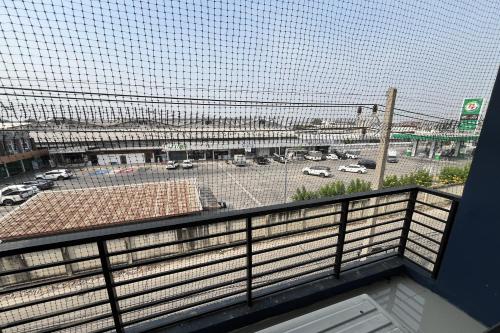 a view of a parking lot from a balcony at Blue26 in Ban Wat Sala Daeng