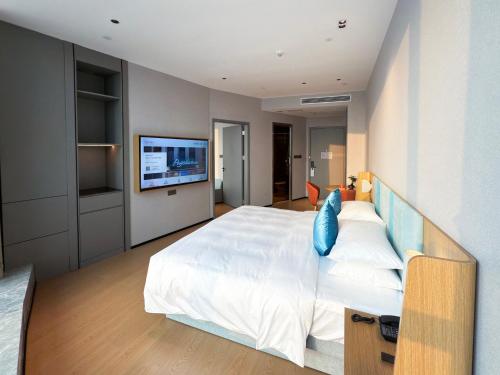 Pagoda Hotel Chongqing Jiefangbeiにあるベッド