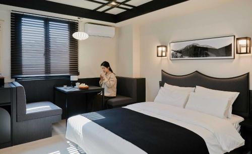 Postel nebo postele na pokoji v ubytování Aank Hotel and Spa Jongno Unni