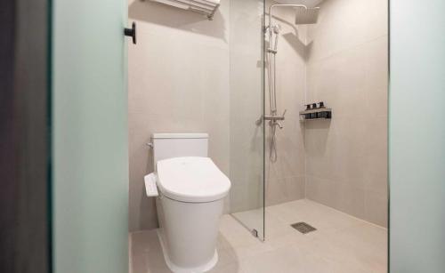 a bathroom with a toilet and a shower at Aank Hotel and Spa Jongno Unni in Seoul