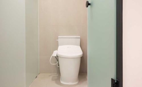 a bathroom with a white toilet in a stall at Aank Hotel and Spa Jongno Unni in Seoul