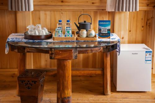 a table with bottles of water on top of it at Celestial Valley in Zhangjiajie