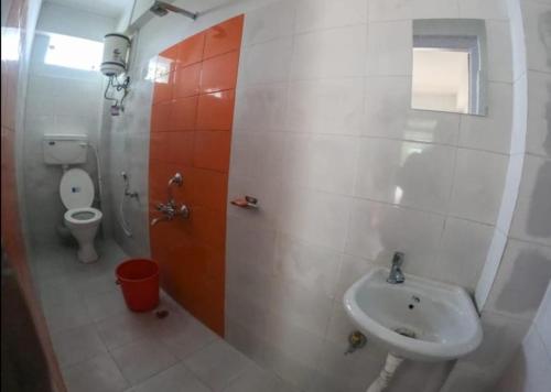 a bathroom with a sink and a toilet at Mountain Paradise Homestay By StayApart in Darjeeling