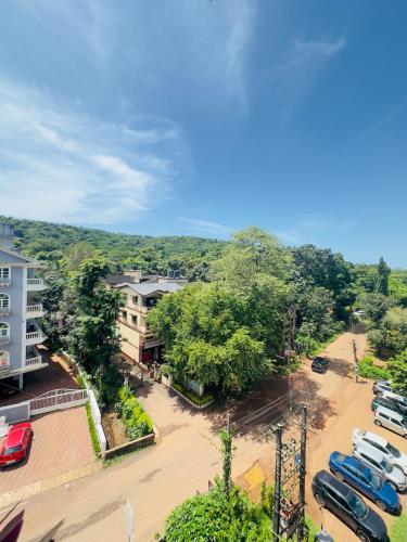an aerial view of a parking lot with cars parked at Abode 3-2 bhk attic private terrace Siolim Marna in Camorlim