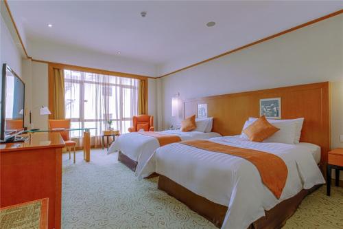 Uma cama ou camas num quarto em Pullman Zhangjiajie Hotel - Instagrammable