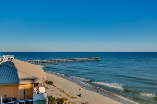 a building on a beach next to the ocean at Experience the ultimate beachfront lifestyle at Oceans One 1 Bdr, 16th or17th Fl in Myrtle Beach