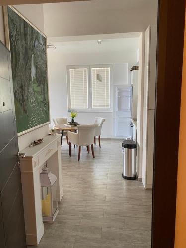 a kitchen and dining room with a table and chairs at Apart Bella Utjeha Sea View 68 qm in Utjeha