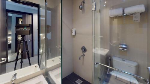 Koupelna v ubytování Unisi Hotel Malioboro - Jogja Syariah