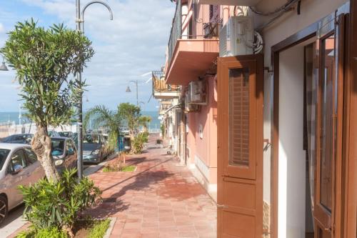 a street in front of a building at I Faraglioni Comfort Rooms in Terrasini