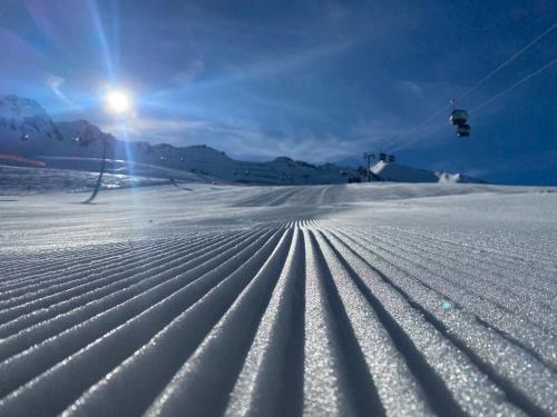 a snow covered slope with a ski lift at Appartement Gurgl in Obergurgl