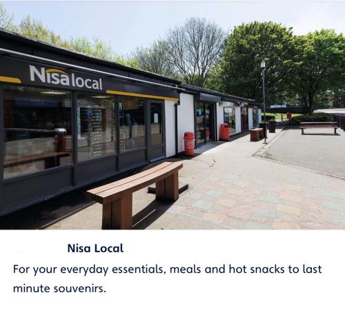 a post with a picture of a nissanlocal store with a bench at Haven cleethorpes beach holiday park in Cleethorpes