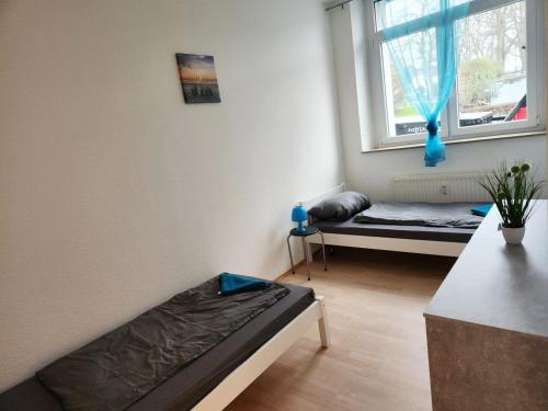 a living room with a bed and a window at Apartment in Herzogenrath-Merkstein in Herzogenrath