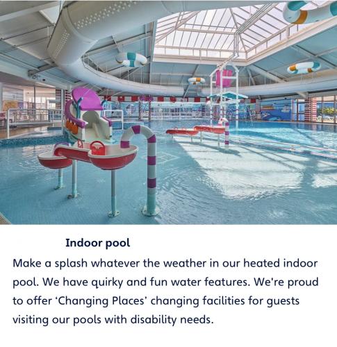a large indoor pool with a water park at Haven cleethorpes beach holiday park in Cleethorpes