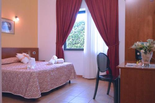 Ένα ή περισσότερα κρεβάτια σε δωμάτιο στο Desusino Residence & Hotel