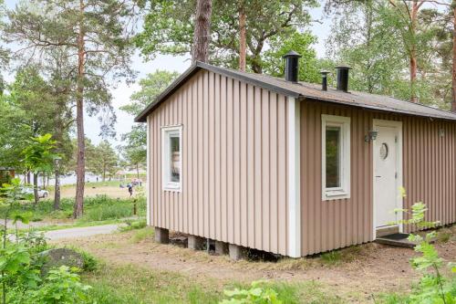 a small house in the middle of a forest at First Camp Gunnarsö-Oskarshamn in Oskarshamn
