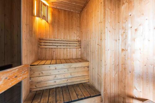 a wooden sauna with a wooden floor and walls at Dorsett Residences Bukit Bintang in Kuala Lumpur