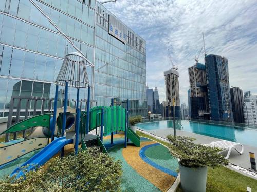 a playground on top of a building with a city at Dorsett Residences Bukit Bintang in Kuala Lumpur