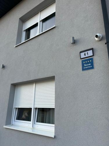 a building with a window and a sign on it at Sleep&Fly Zagreb AIRPORT APARTMENTS in Velika Gorica