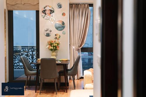a dining room with a table and chairs and a window at High-ser Apartment -2BR - NiceView - Parking - Spacious - In center in Hanoi