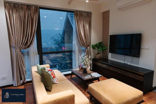 a living room with a large window and a flat screen tv at High-ser Apartment -2BR - NiceView - Parking - Spacious - In center in Hanoi