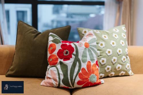 two pillows sitting on top of a couch at High-ser Apartment -2BR - NiceView - Parking - Spacious - In center in Hanoi