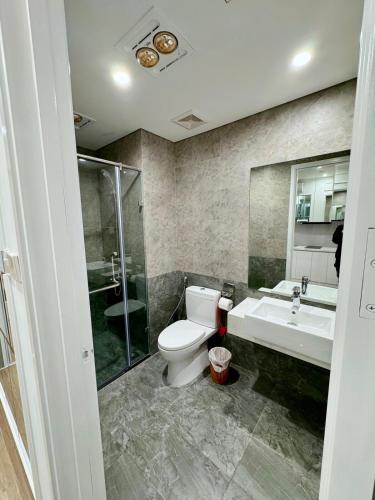 a bathroom with a toilet and a sink and a shower at 1 bedroom - Apartments in luxury in Gia Lâm Pho