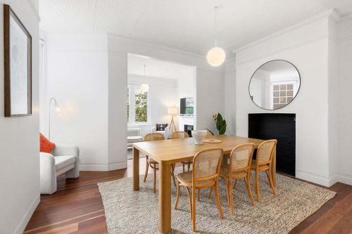 a dining room with a table and chairs at Urban Retreat Near Sydney Harbour in Sydney