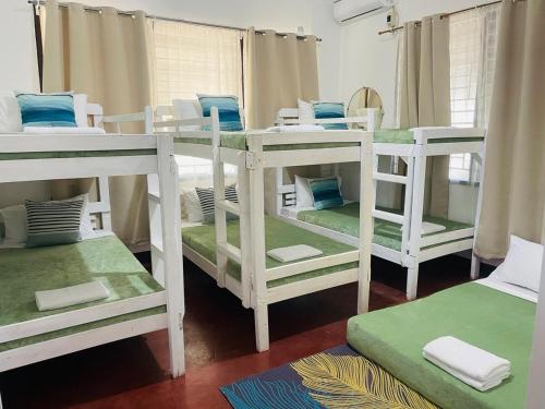 Ένα ή περισσότερα κρεβάτια σε δωμάτιο στο Durrani CozyHouse 5mins walk from the beach