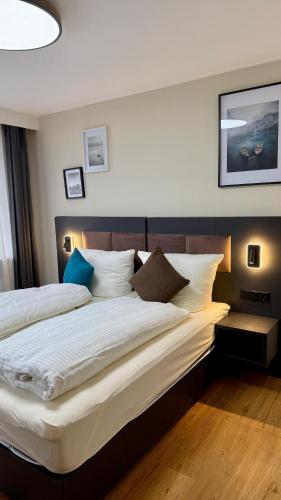 a hotel room with two beds and a large bedvisor at Gasthaus Adler in Dietingen