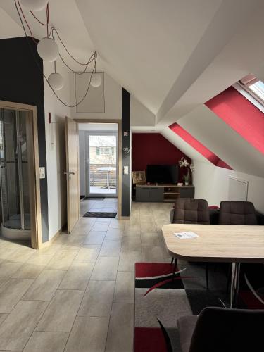 a living room with a table and a couch at Semihome in Dietingen