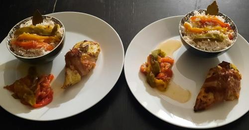 two plates of food with rice and vegetables on them at Les Vagabonds du Mont in Chichilianne