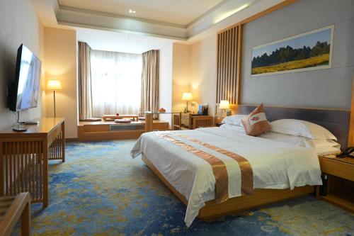 Katil atau katil-katil dalam bilik di Huayu Hotel
