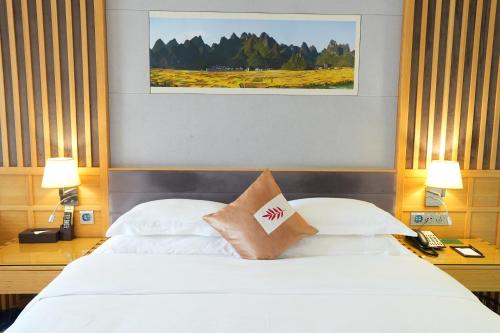 Katil atau katil-katil dalam bilik di Huayu Hotel