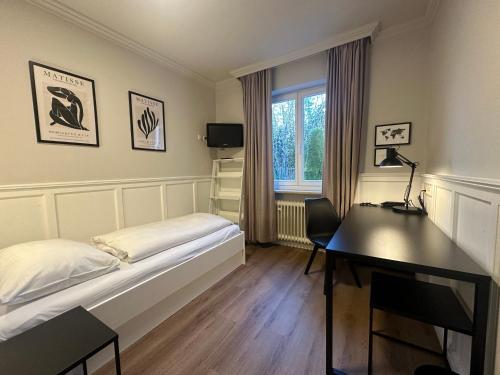 Postel nebo postele na pokoji v ubytování Hotel Villa Solln