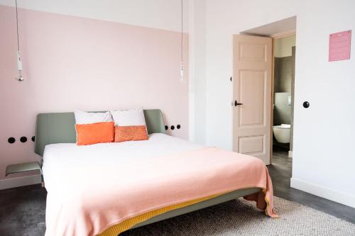 Postel nebo postele na pokoji v ubytování Boetiekhotel Villa Wanrooy