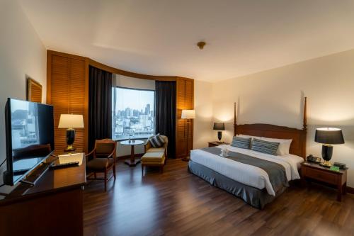 Ένα ή περισσότερα κρεβάτια σε δωμάτιο στο Century Park Hotel