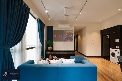 a blue couch in a living room with a window at High-ser Apartment -2BR - NiceView - Parking - Spacious - In center in Hanoi