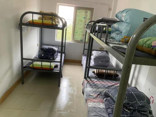 Katil atau katil-katil dalam bilik di Shenzhen Zhongge Budget Homestay Pingzhou Subway Station Branch