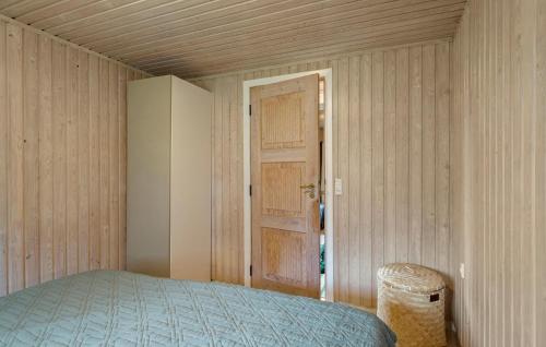 a small room with a bed and a door at Stunning Home In Martofte With Wifi in Martofte