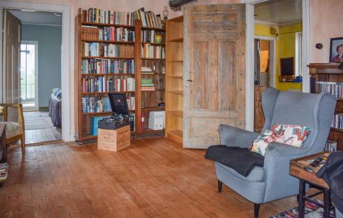 a living room with book shelves filled with books at Beautiful Home In Smedstorp With Wifi in Smedstorp