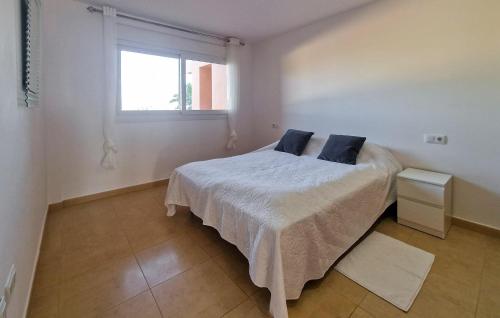 a bedroom with a bed with two pillows on it at Beautiful Apartment In Torrepacheco in Torre-Pacheco