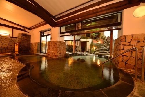 a large indoor pool in a house at Hakone Kamon in Hakone