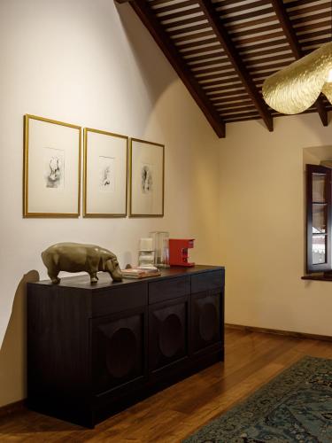a room with a table with a bear statue on it at The Bungalow Galle Fort - Hotel - Restaurant - Cocktail bar in Galle