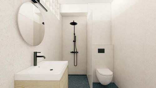 a bathroom with a sink and a mirror and a toilet at Bluetto in Trnava