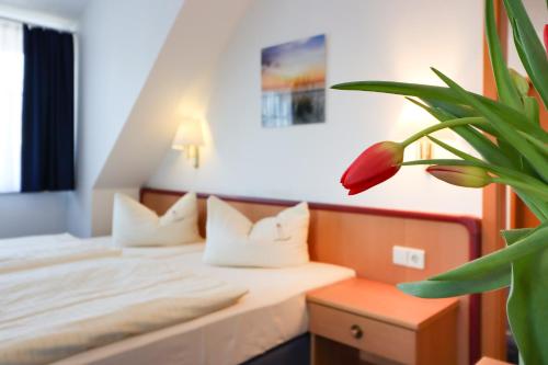 Postel nebo postele na pokoji v ubytování Aparthotel Leuchtfeuer Rügen