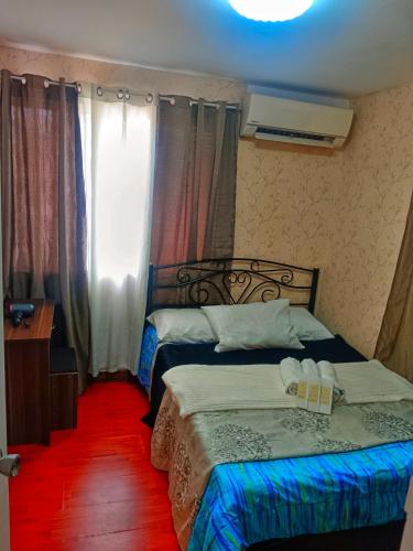 Katil atau katil-katil dalam bilik di Camella gensan transient