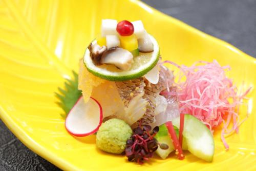 a yellow plate with a sandwich with vegetables on it at Hakone Kamon in Hakone