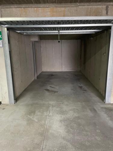an empty parking garage with a large room at Villa Irma in Chiesa in Valmalenco