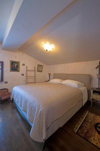 a bedroom with a large bed in a room at Kleopatra's House in Karavostamo